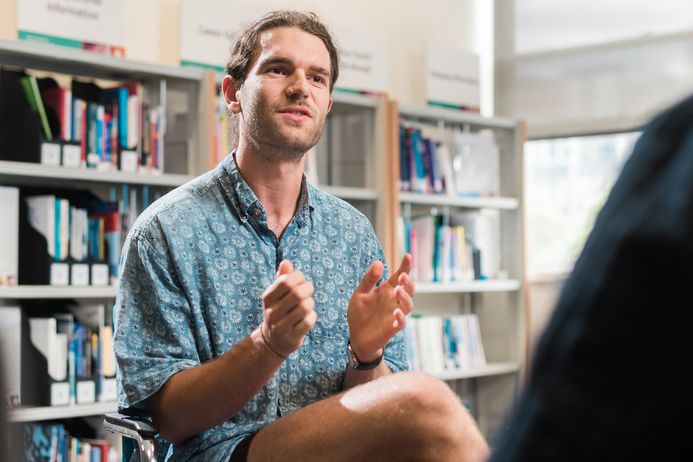 Man talking in library