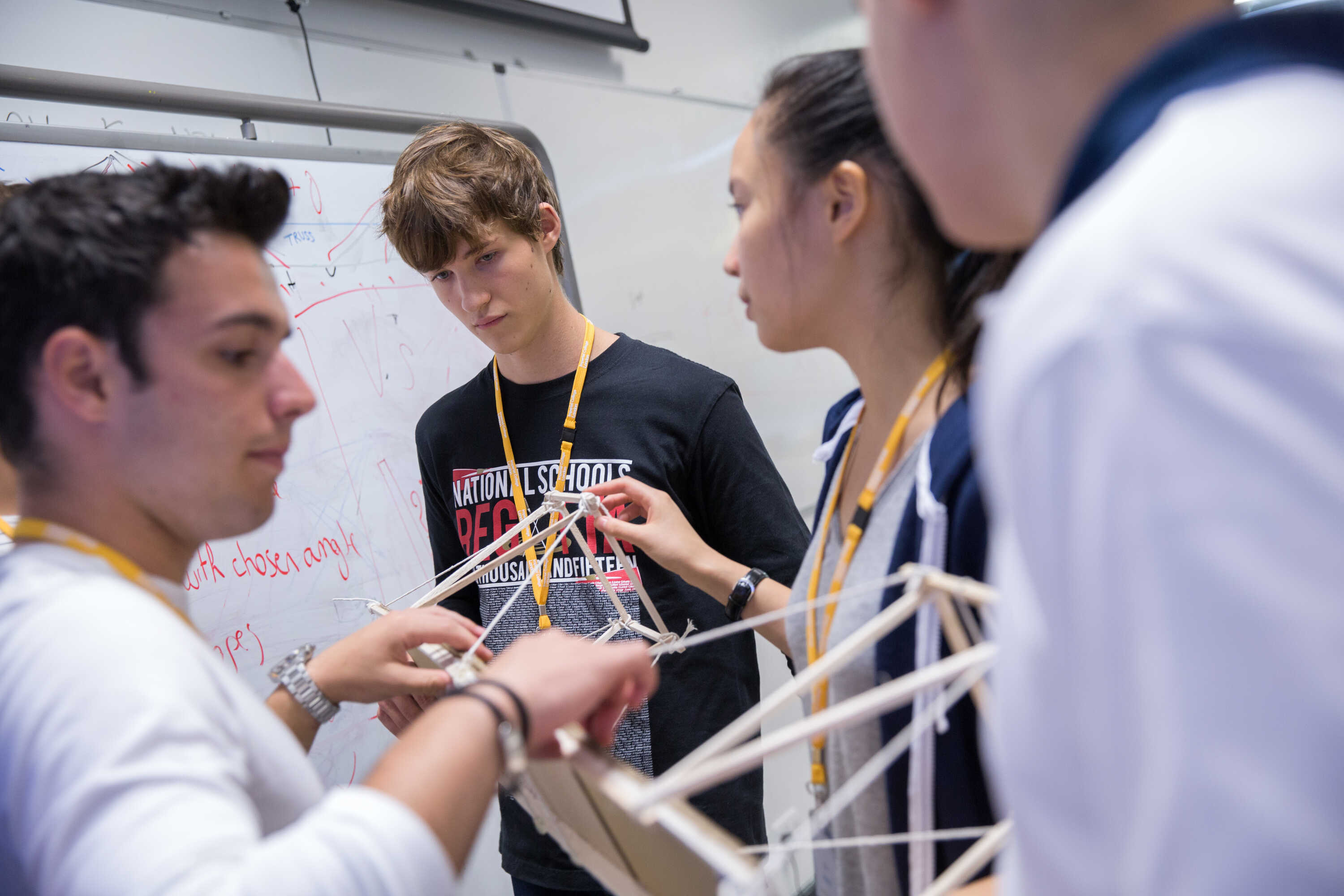 Globl Summer School students building a model bridge