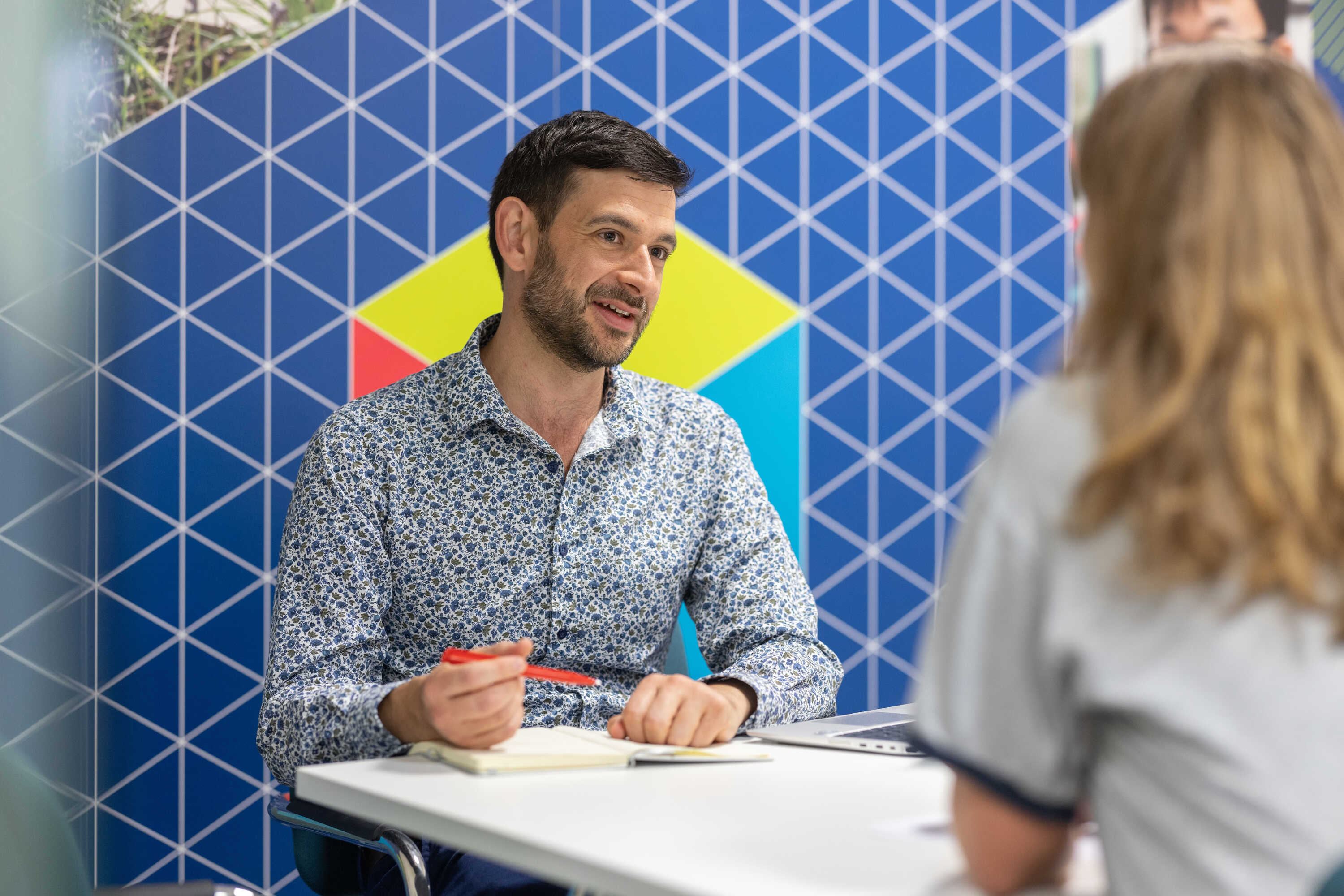 A student talking to a member of the Student Financial support team