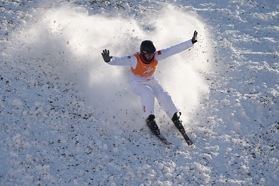 Li Xinpeng of China competes during the Freestyle Skiing mixed team aerials final at the 9th Asian Winter Games in Yabuli, northeast China's Heilongjiang Province