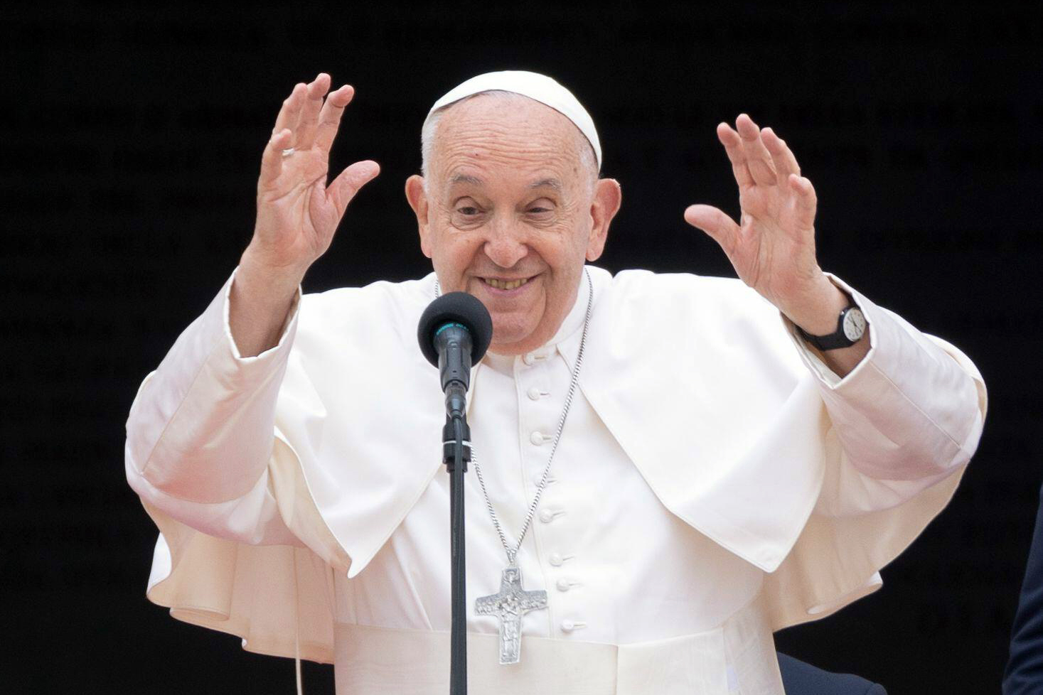 POPE FRANCIS GREETS the faithful from Michelangelo Buonarroti's staircase on Piazza del Campidoglio in Rome.