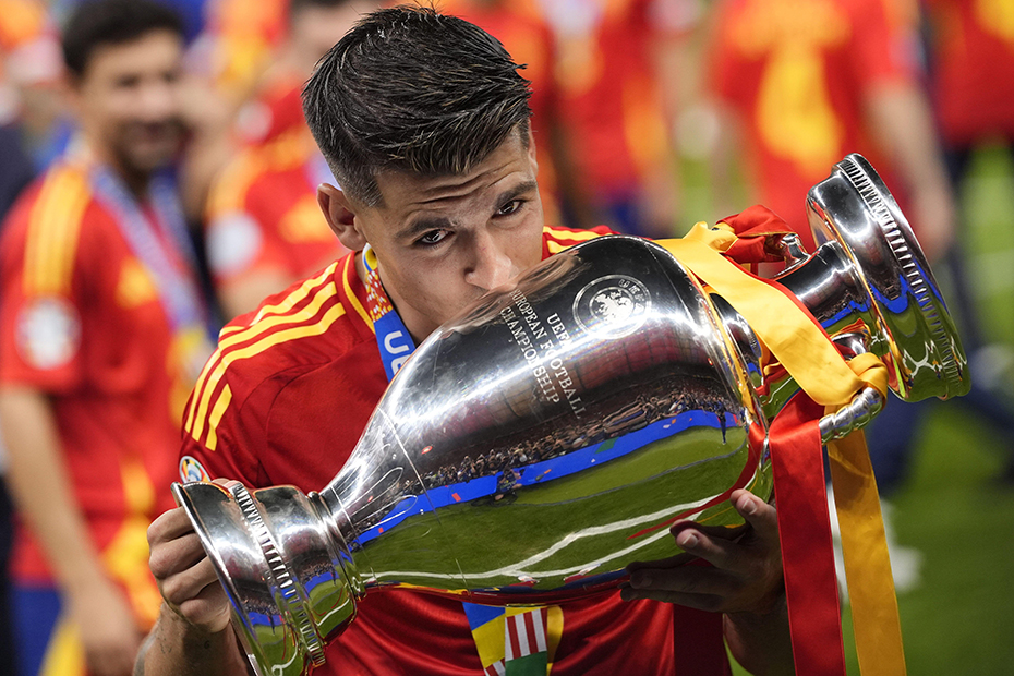 Spain's Alvaro Morata with the trophy celebrates after a final match between Spain and England at the Euro 2024 soccer tournament in Berlin at Olympiastadium, Germany