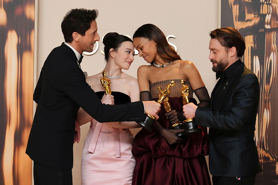 Adrien Brody, Mikey Madison, Zoe Saldana and Kieran Culkin pose in the press room at the Oscars