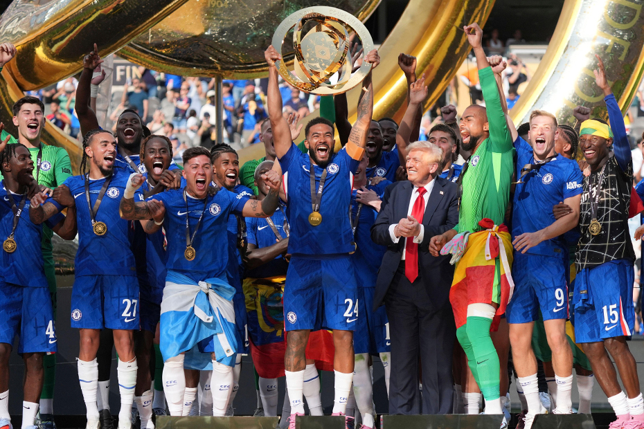 President Donald Trump, sixth from right, watches as Chelsea's Reece James (24) lifts the trophy following the Club World Cup final soccer match between Chelsea and PSG at MetLife Stadium in East Rutherford, N.J.