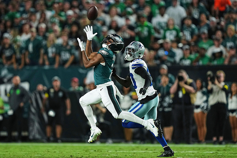 Philadelphia Eagles wide receiver Jahan Dotson reaches up to catch a pass as Dallas Cowboys' Kaiir Elam (20) defends in the first half of an NFL football game