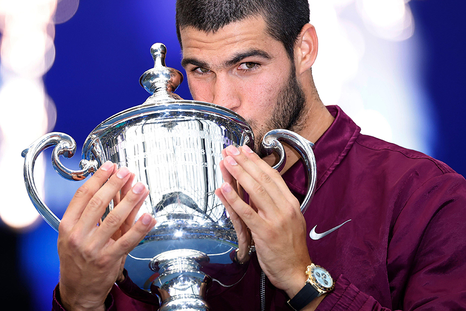Carlos Alcaraz of Spain kisses his winners trophy after defeating Jannik Sinner of Italy in the Men's Final match at the 2025 US Open Tennis Championship