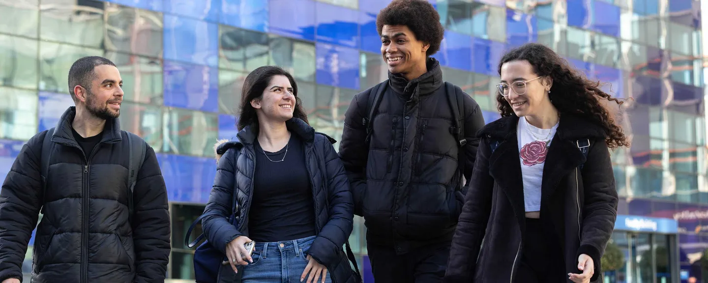 Group of students walking around the campus