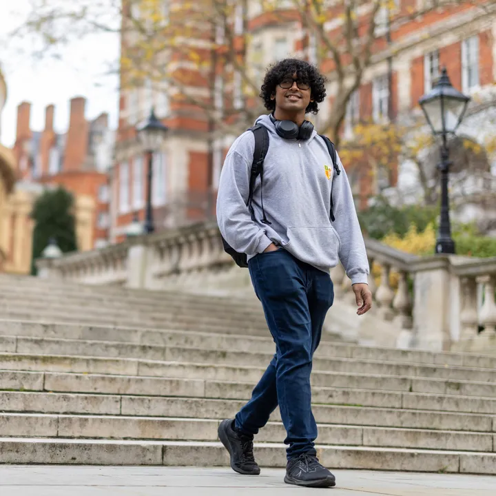 A student walking down the steps outside the Royal Albert Hall