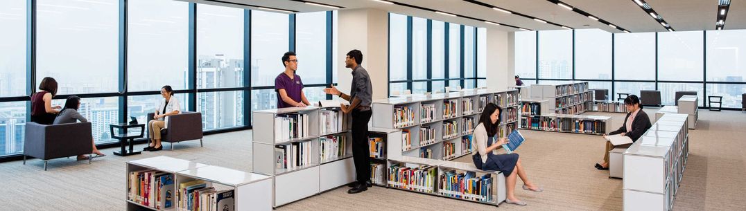 Inside the medical library with people present