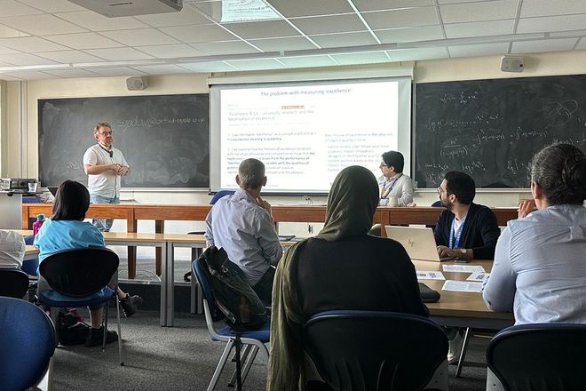 Image showing presenters and workshop participants engaging with presentation slides