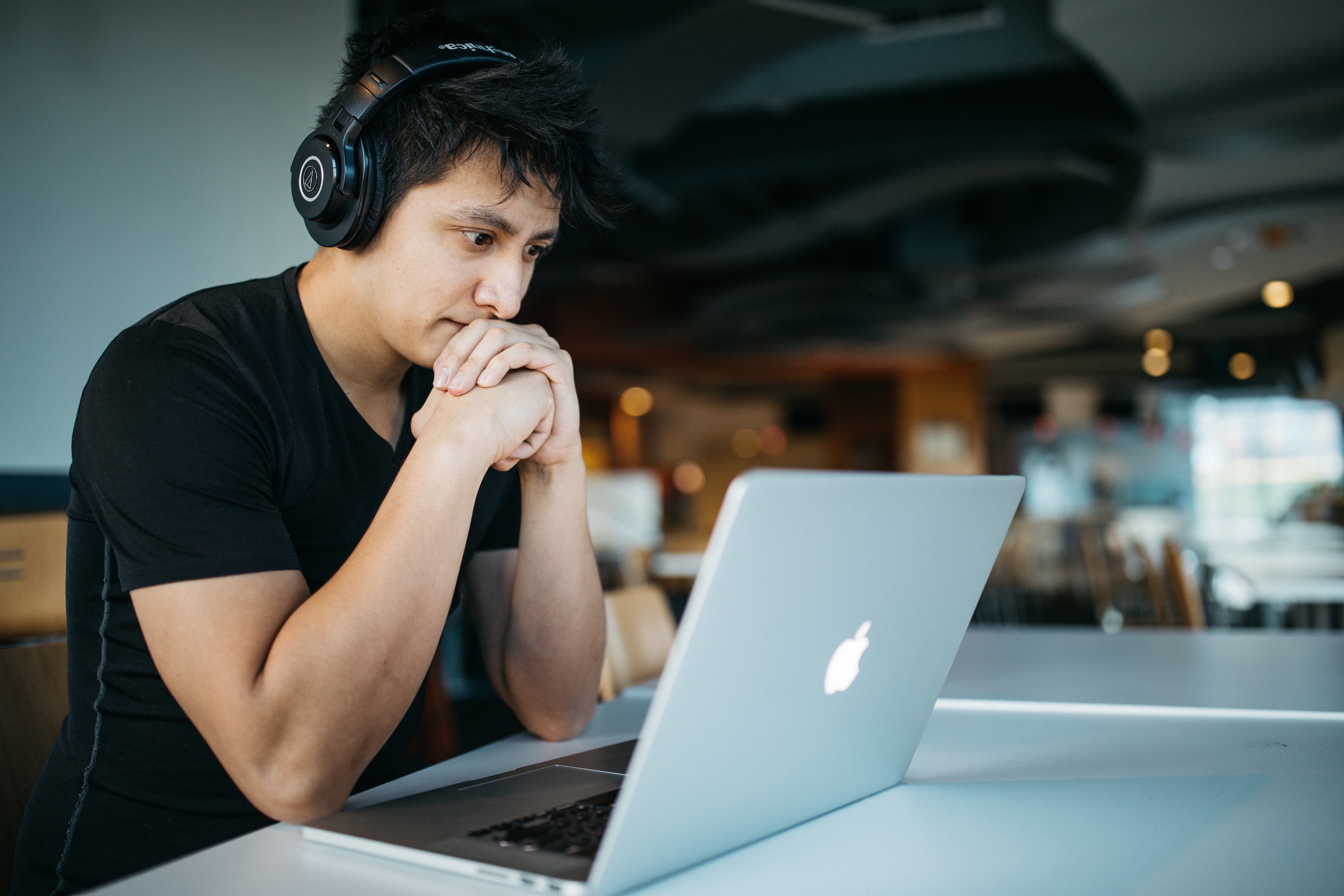 A student looking at a laptop screen